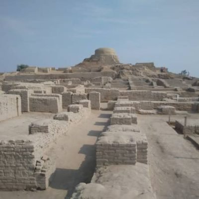 A wide distance shot of Brick walls, streets, common bath and budhist stupa of old city of mohenjo daro.