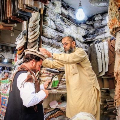 Market scene with fabric vendors