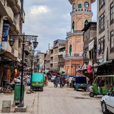 Busy street with clock tower.